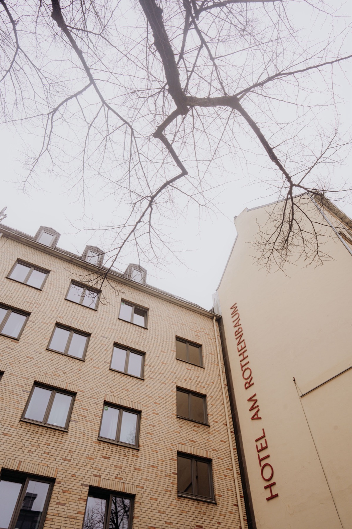 Facade of Hotel am Rothenbaum with its red lettering